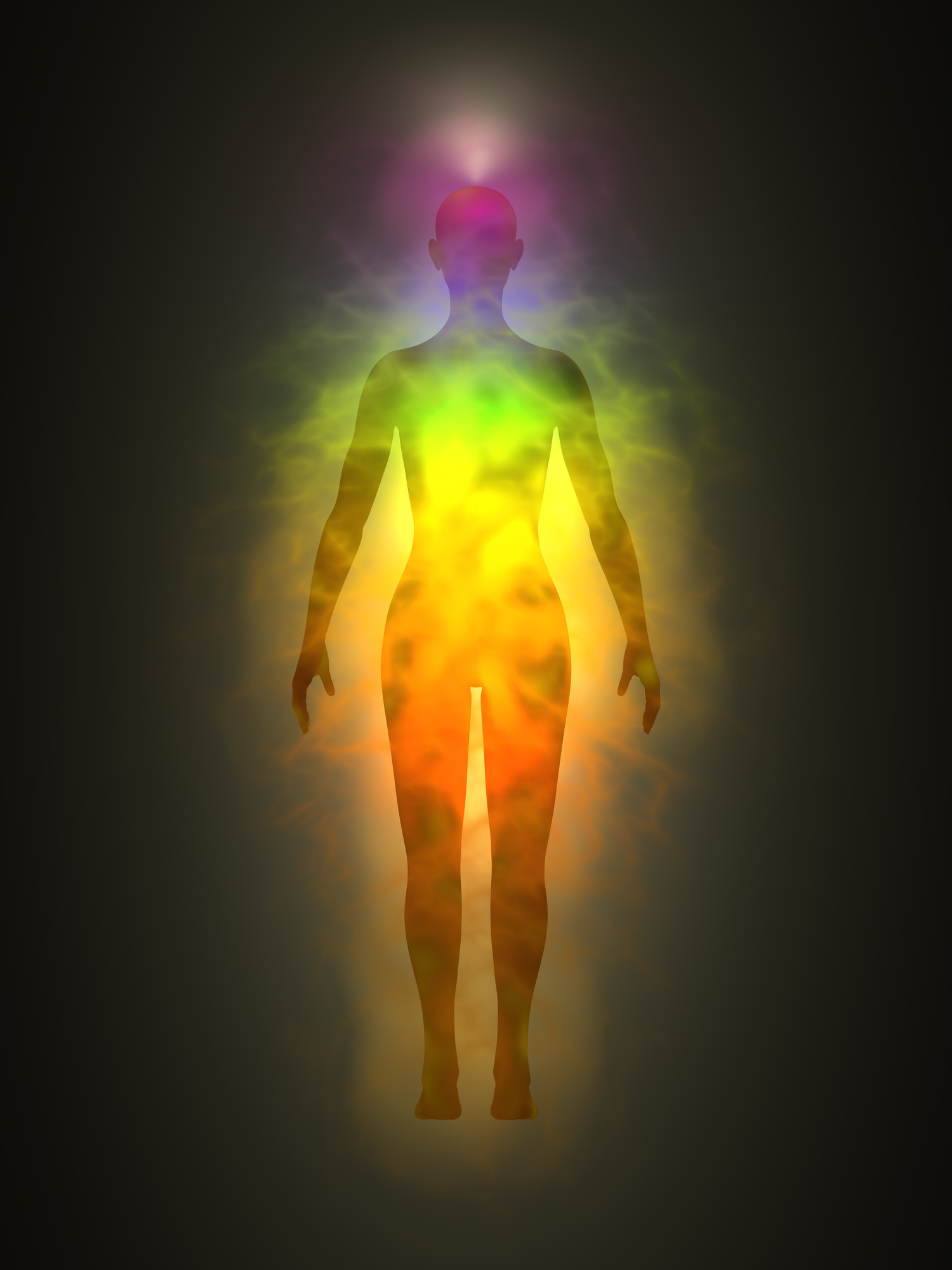 Picture of human aura. Silhouette with aura and chakras. Theme of healing energy, connection between the body and soul.